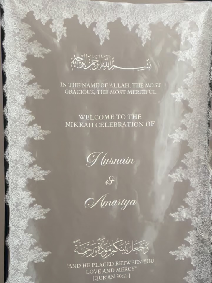 Nikkah welcome sign edged with lace and personalised with the couple’s names