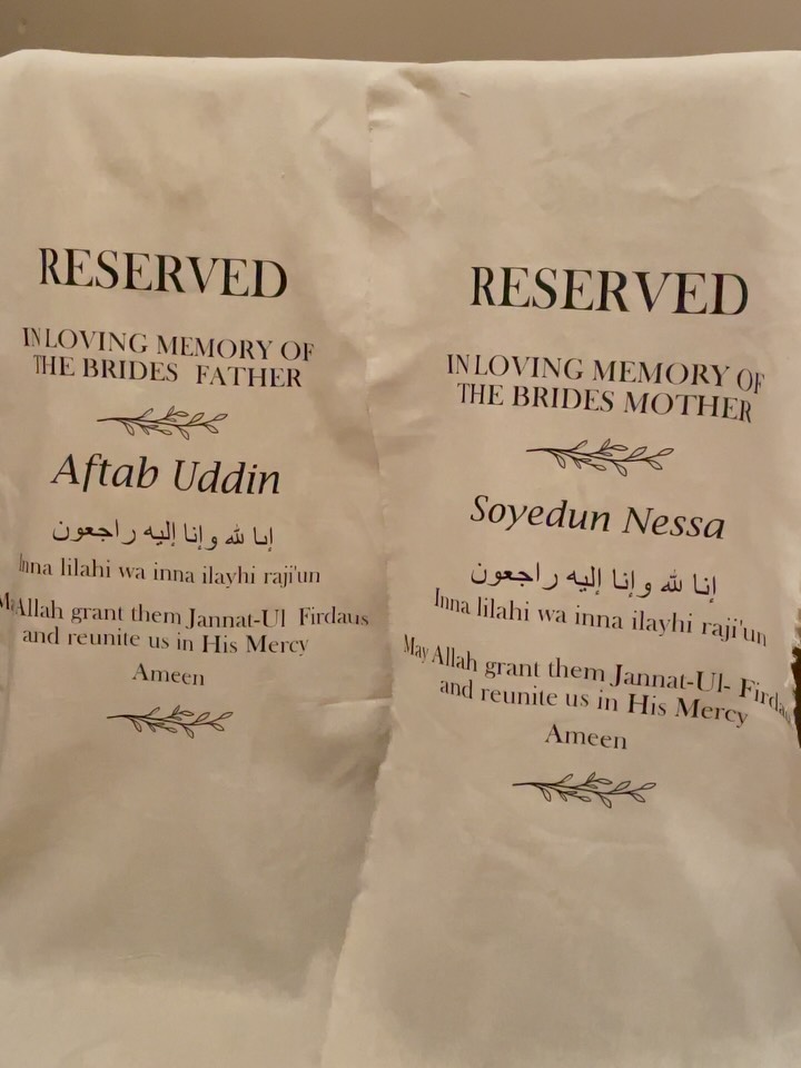 Reserved-seat sign for the bride’s parents, with a personal tribute